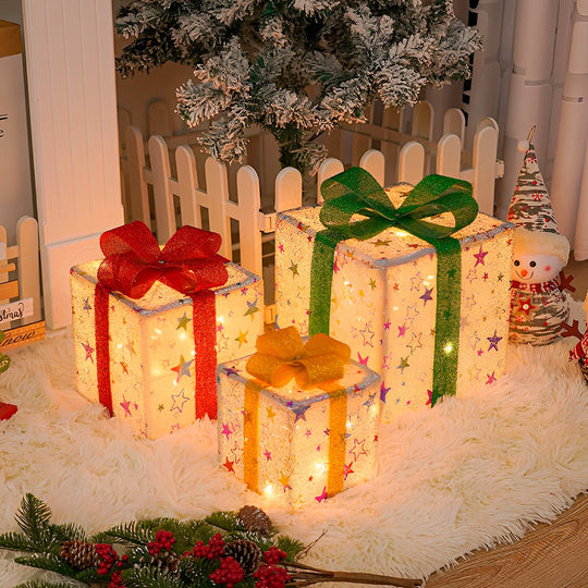 Caixa de presente de Natal iluminada, kit de três caixas modelo estrelas sobre tapete branco