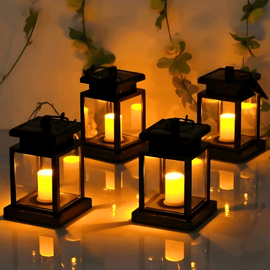 Lanterna solar de jardim com vela de LED, em quatro peças acesas com luz amarelada