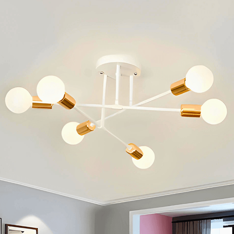 Lustre branco com soquetes dourados e seis globos brancos acesos, junto à moldura do teto
