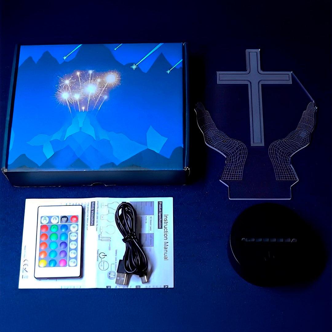 Placa de acrílico, base preta, controle remoto e cabo USB dispostos ao lado da caixa