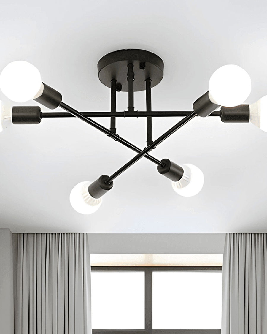 Em preto, o lustre se destaca no teto branco