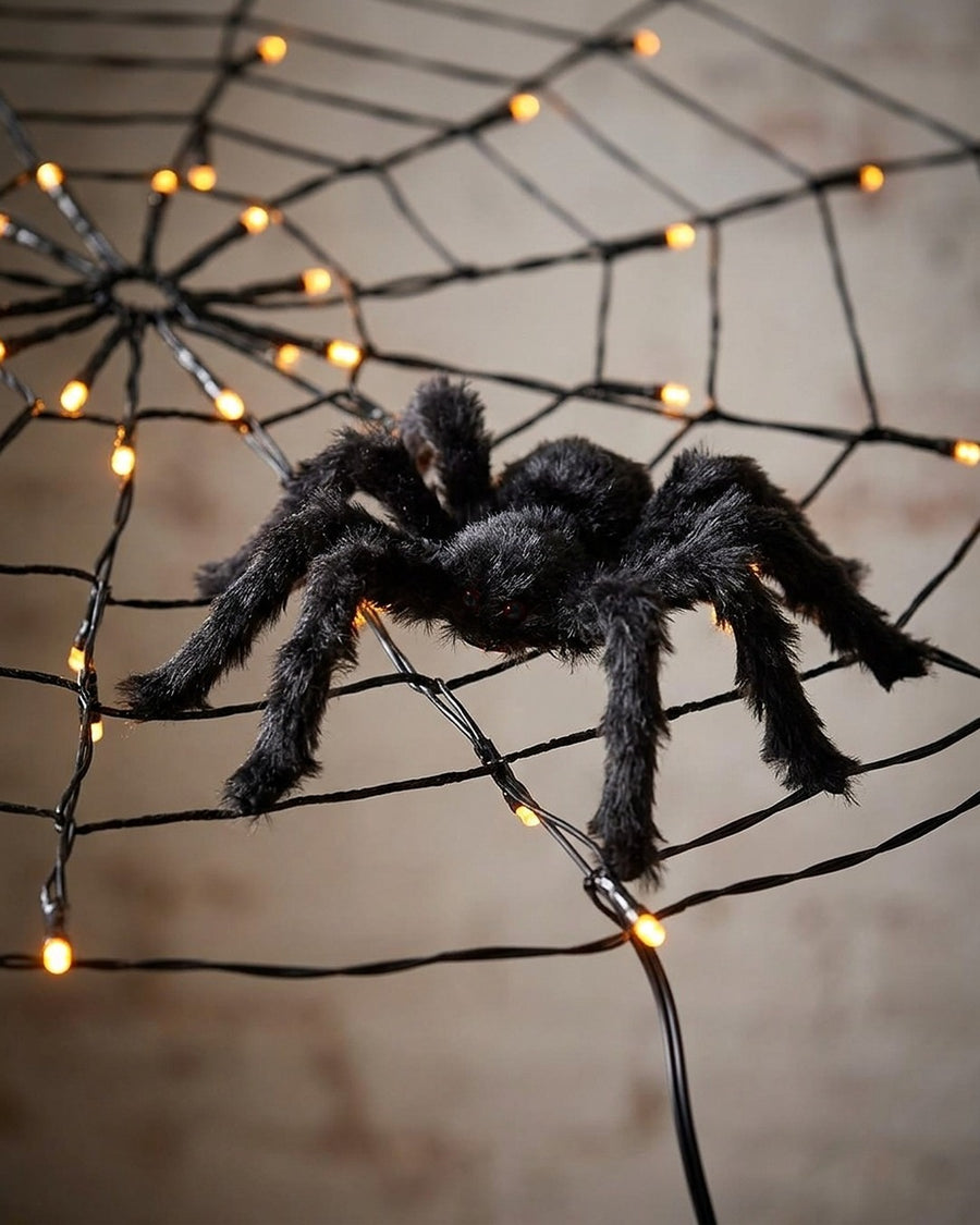 Teia de aranha LED laranja ou roxa no ambiente