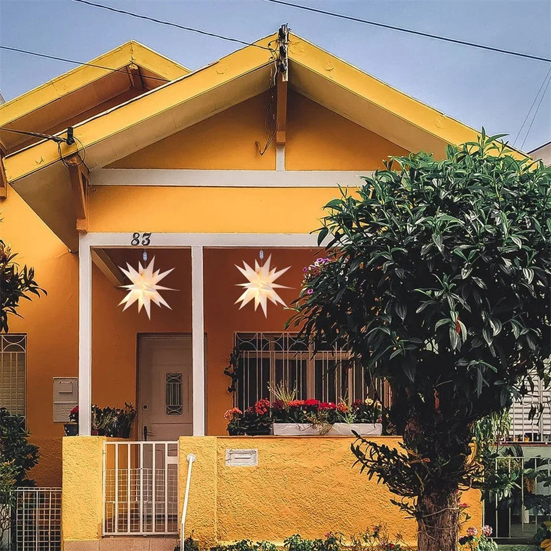 Ambiente · duas estrelas na varanda de uma casa amarela