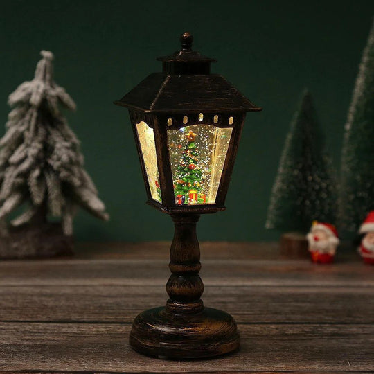 Globo de neve em forma de lanterna de poste antigo, preto, com árvore de Natal iluminada na água com glitter